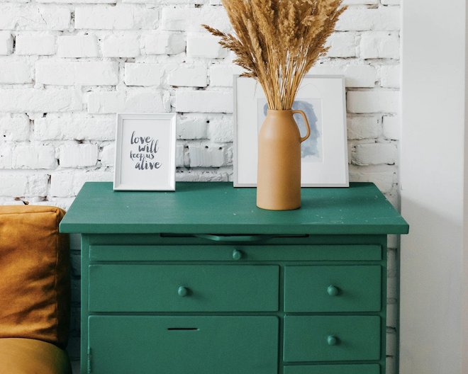 end table with flowers and family portrait